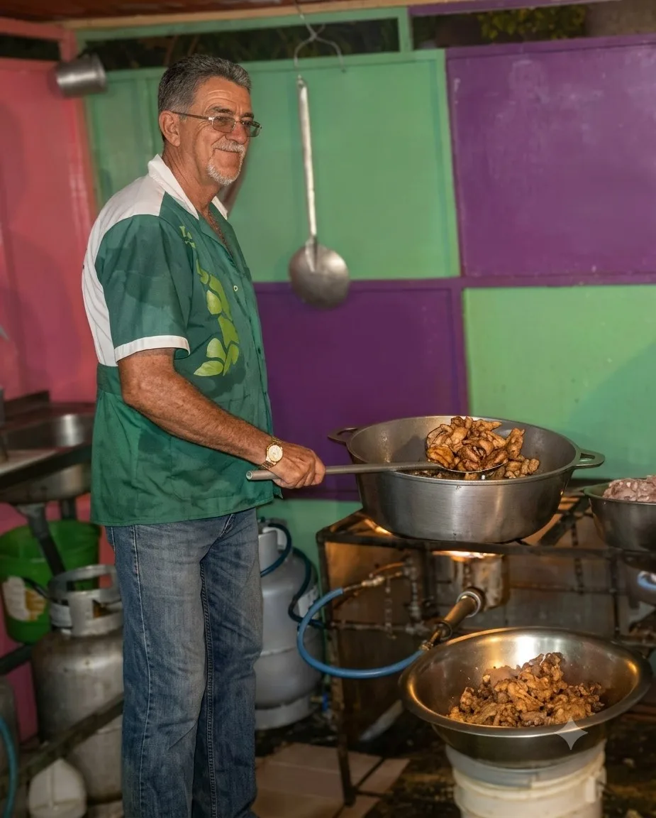 Don Luis Varela cooking at his food stall at a village fair