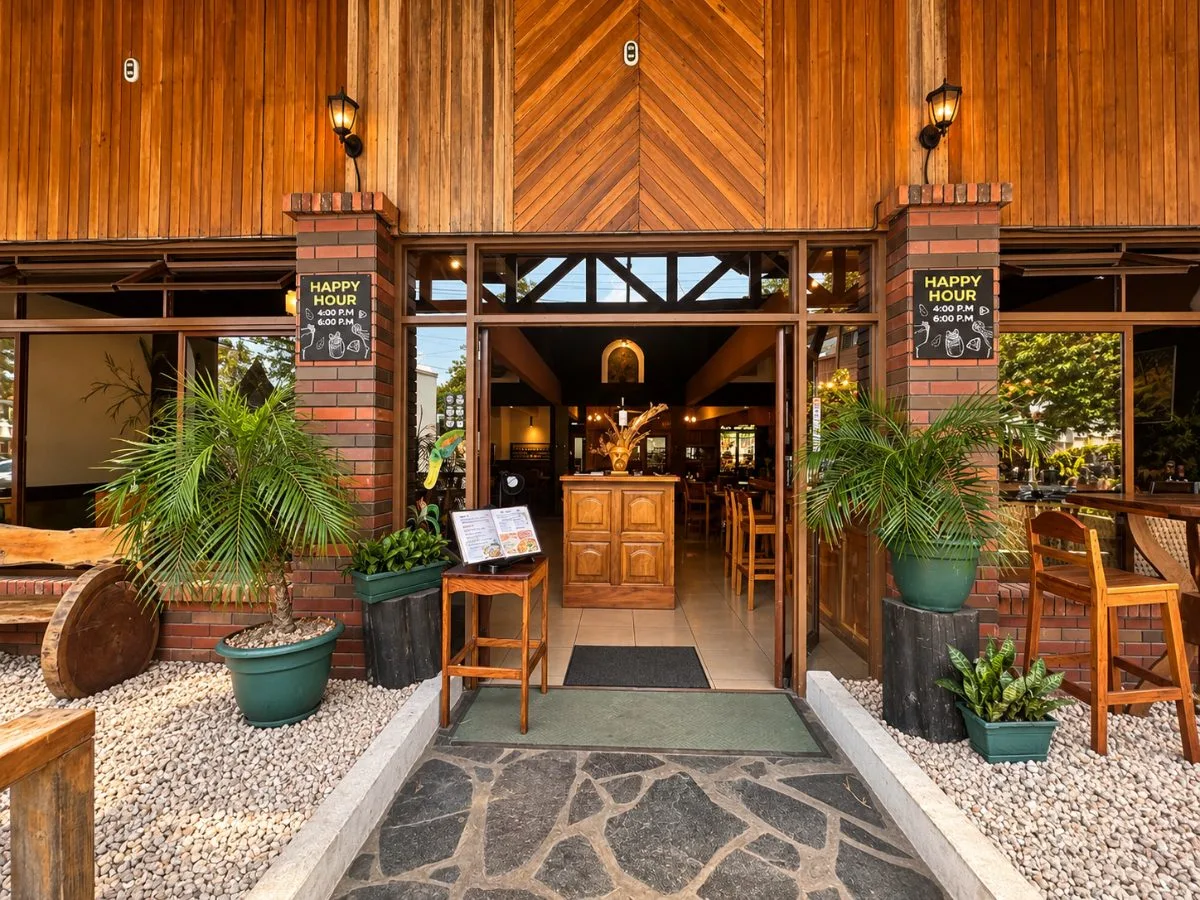 Don Luis main entrance, wooden doors open and the Happy Hour boards