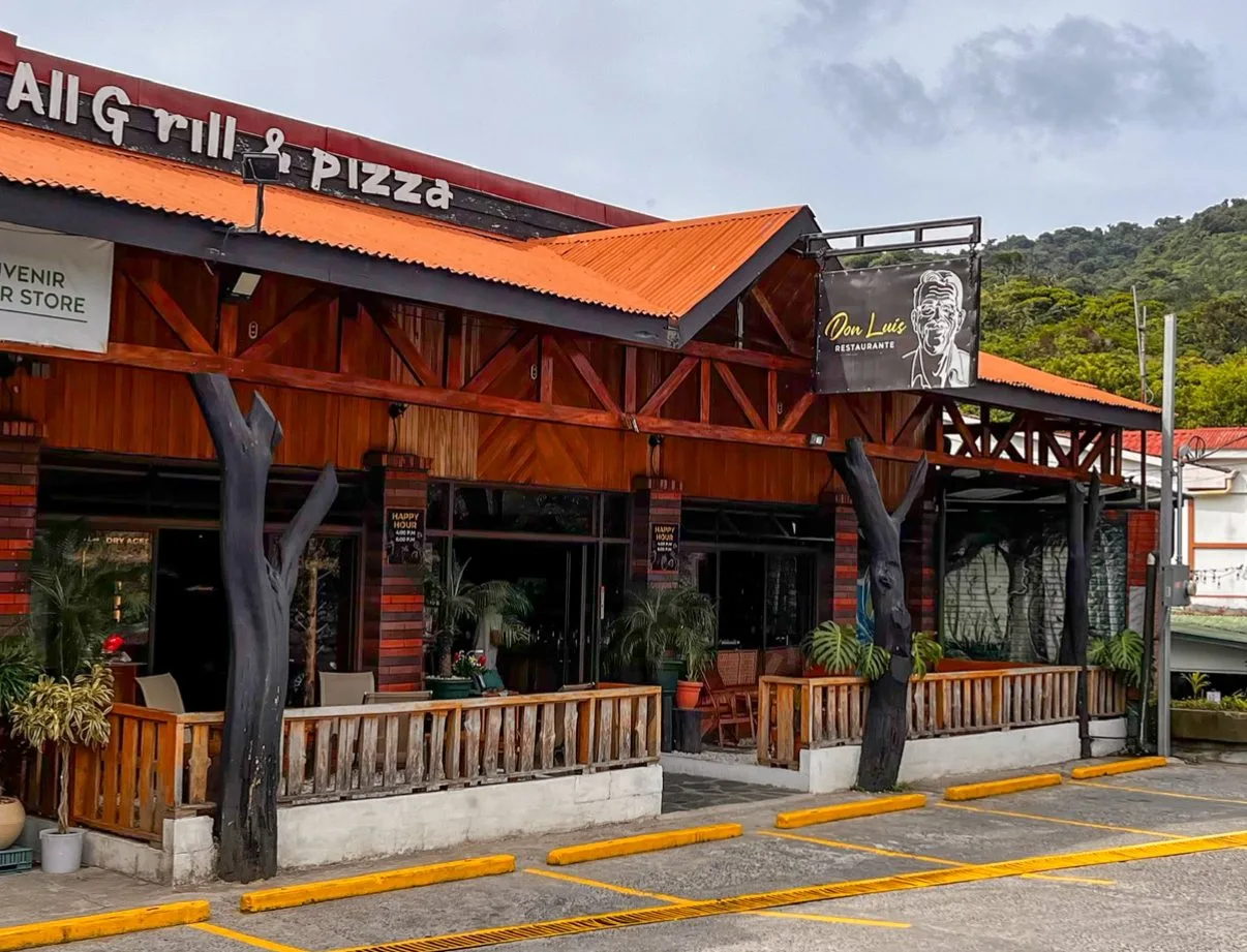 Don Luis seen from the street, with the sign and free parking out front